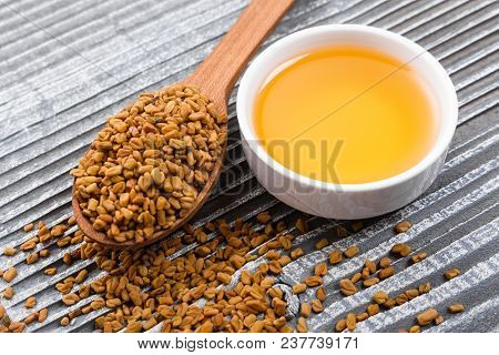 Fragrant Grains Of Fenugreek On A Rustic Background.