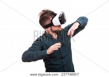Young Man Experiencing Virtual Reality For The Firts Time. Isolated Over White Background. Studio Ph