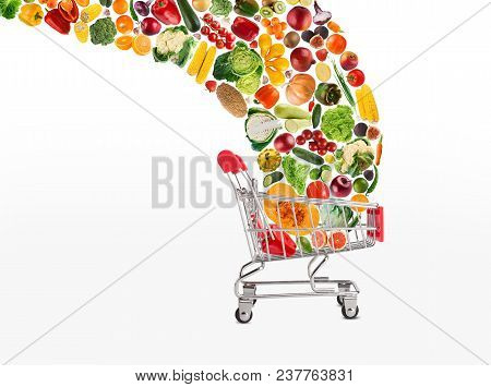 Grocery Cart With Vegetables And Fruits Falling In It Isolated On White. Healthy Meals Shopping, Cor