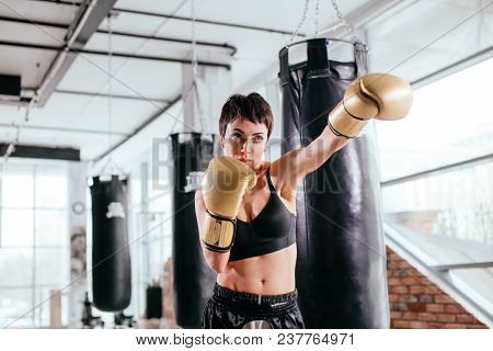Athlete Stucking At Opponent At Sport Centure. Enjoy Boxing.heavy Blow.