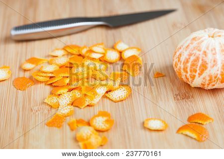 Tasty And Healthy Zest Of Fresh Mandarin On A Wooden Table Close-up