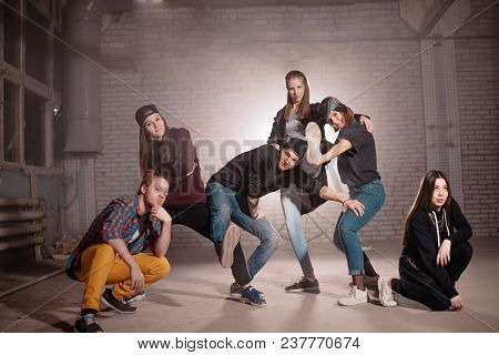 Horizontal Shot Of Unpredictable Street Youth In Building. Daring Teens.