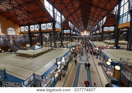 BUDAPEST, HUNGARY - MARCH 29, 2018: Great Market Hall in Budapest, people shopping around for groceries