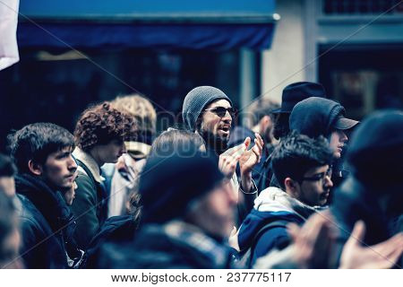 Strasbourg, France  - Mar 22, 2018: Man With Sunglasses In The Middle Of Crowd At Demonstration Prot