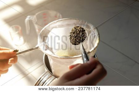 Thai Woman Making A Milk Green Tea Using Tea Filter Bag..