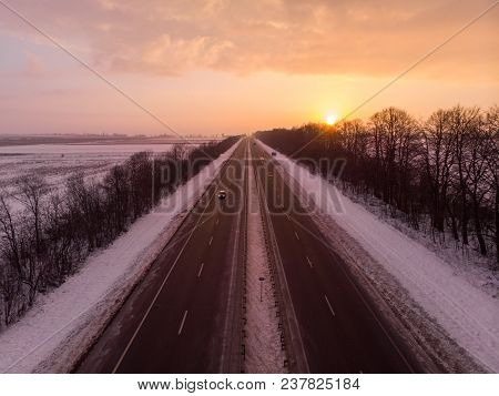 Beautiful Sunrise Aerial View Above Highway. Car Travel Concept