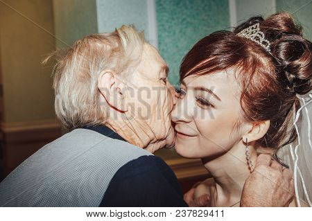 Russia, Kirov - November 24, 2017: Guest Or Relative Congratulates Bride And Groom In The Registry O