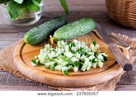 Fresh Cucumber Cubes On A Cutting Board On The Table
