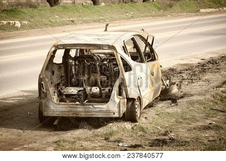 An abandoned, stolen burnt out car