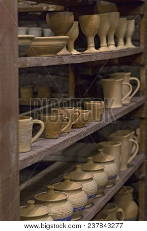 Handmade Clay Ware. Dishes On The Shelves.
