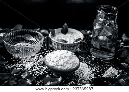 Ayurvedic Ubtan Of Rose Water,gram Flour,oats And Rose Petals Or Face Pack On Wooden Surface Helps I