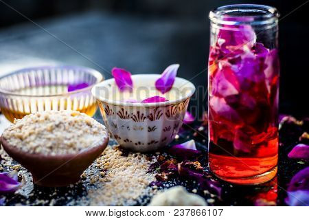 Ayurvedic Ubtan Of Rose Water,gram Flour,oats And Rose Petals Or Face Pack On Wooden Surface Helps I