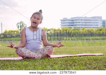Healthy Yoga Girls And Concentrate In The Park , Kid Yoga Practice For Health In The Nice Day , Yoga