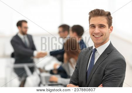 Business partners shaking hands over business objects on workpla