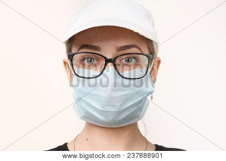 Girl In Medical Mask With Respirator On White Background.