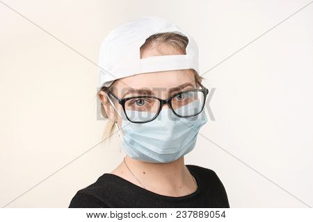 Girl In Medical Mask With Respirator On White Background.