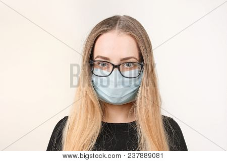 Girl In Medical Mask With Respirator On White Background.