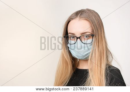 Girl In Medical Mask With Respirator On White Background.