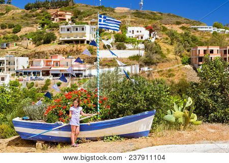 Girl With Lemon Against Fishing Boat, Bali, Greece