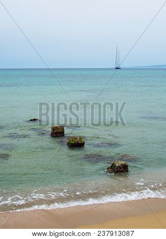Old Stone Pier In The Green Water In Mallorca, Spain