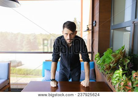 Caucasian Businessman Standing At Office And Wearing Black Shirt. Concept Of Responsibility And Succ