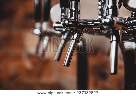 Number Of Chrome-plated Faucets For Pouring Beer In Bar, Pub.