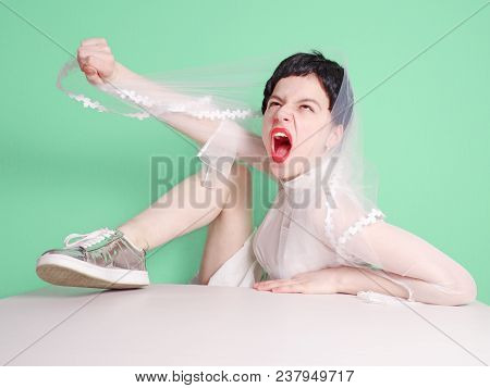 A Funny Emotional Bride Put Her Foot On The Table With A Sharp Cry From An Excited State