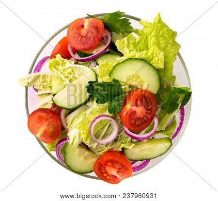 Vegetable Salad In Glass Plate On A White Background Isolated. The View From The Top.