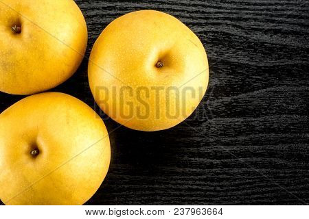 Chinese Golden Pears Top View Nashi Variety Isolated On Black Wooden Background Three Whole Round