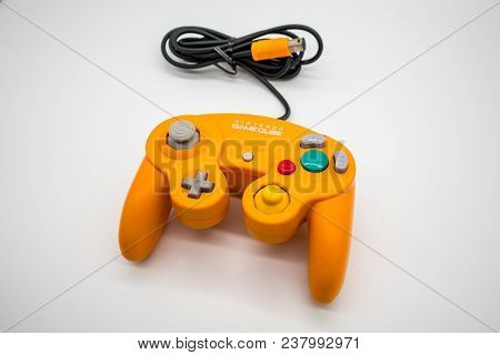 Bangkok, Thailand - March 7, 2018: Nintendo Gamecube Controller In Orange Color, Vintage Portable Ga