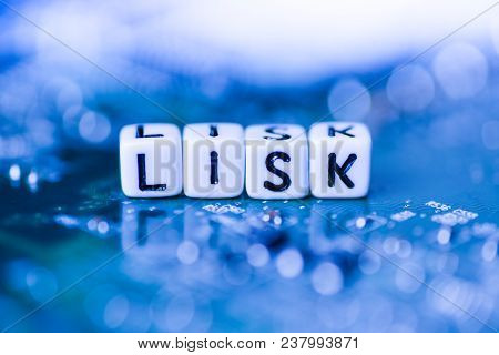 Word Lisk Formed By Alphabet Blocks On Mother Cryptocurrency Closeup