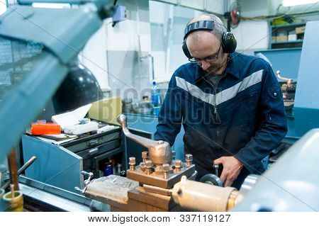Tyumen, Russia - June 5, 2019: Aircraft Repair Helicopter Utair Engineering Plant. Worker Turner Ope