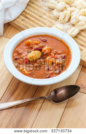 Italian Cuisine Sausage Gnocchi Soup With Tomato Basil Broth