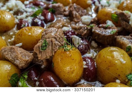 Cooking Greek Lamb Stew Marinated In A White Wine Salmoriglio Sauce With New Potatoes Kalamata Olive