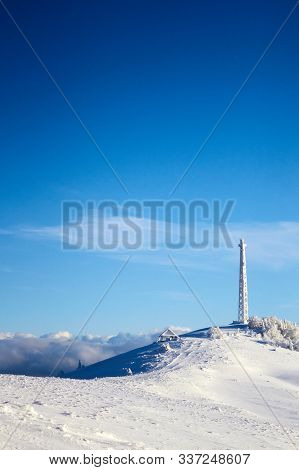 Icy Cellular Base Station Antenna Covered With Snow. Cell Site Tower On Moutain Hill. Telephone Netw