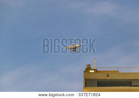 Drone Flying At Clean Blue Sky