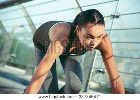 Serious Professional Athlete At The Crouch Start Stock Photo