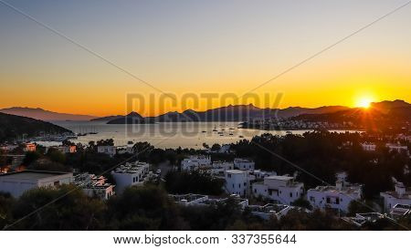 Bright Colorful Sunset In The Beautiful Bay Of The Aegean Sea With Islands, Mountains And Boats. Sum