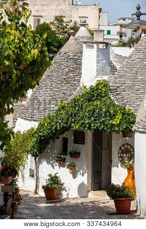 Alberobello, Italy - September 16, 2019: Tradtional White Houses In Trulli Village. Alberobello, Ita