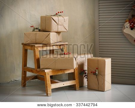 Christmas Presents In Boxes With Decoration Close Up Photo In Room Interior