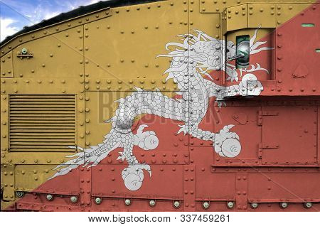 Bhutan Flag Depicted On Side Part Of Military Armored Tank Closeup. Army Forces Conceptual Backgroun