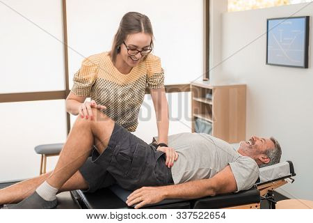 Man Having Chiropractic Back Adjustment. Physioterapy, Osteopathy, Alternative Medicine Pain Relief 