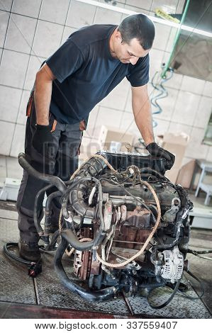 Removed Engine From Car. Auto Mechanic Repairs Car Engine