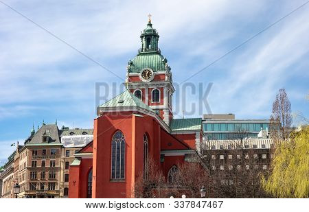 Stockholm, Sweden - April 19, 2019: The Red Saint James Church (jakobs Kyrka) In Stockholm With Blue