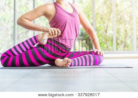 Close-up Of Asian Women Workout Practicing Yoga Training Put On Pink Clothes And Practice Meditation