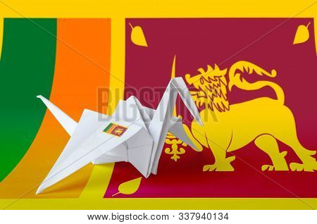 Sri Lanka Flag Depicted On Paper Origami Crane Wing. Handmade Arts Concept