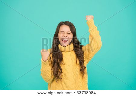 Adorable Smiling Girl Wear Yellow Sweater Turquoise Background. Positivity Concept. Good Vibes. Emot