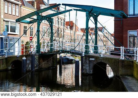 Cityscape Of Leiden, The Netherlands. View Of New Rhine River And Dutch Houses.
