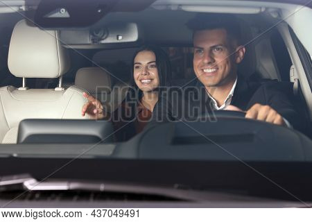 Young Woman And Taxi Driver In Modern Car, View Through Windshield