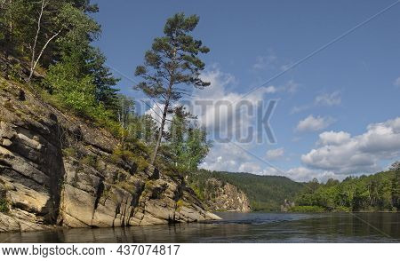 Russia. Chita Region. Coastal Rocks On The Burkal River, Whose Fast Waters Tend To The Selenga River